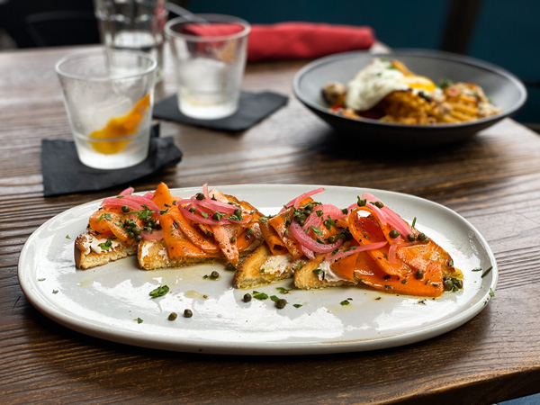 Social Lounge Rooftop Restaurant Asheville Brunch with vegan lox with toast, capers, and carrots