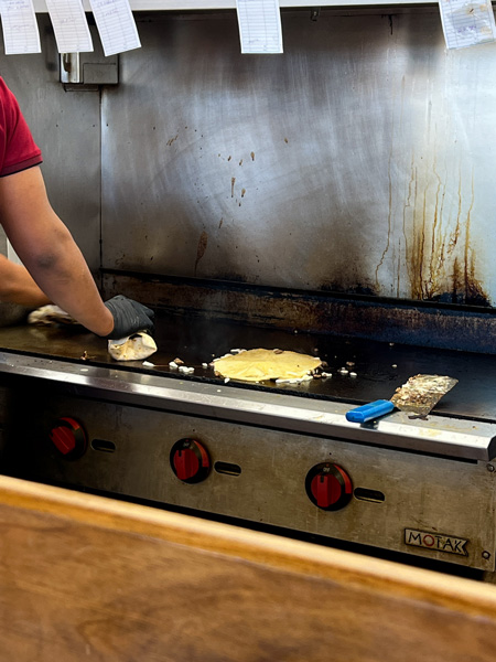 Taqueria Munoz Cooking Food On Grill
