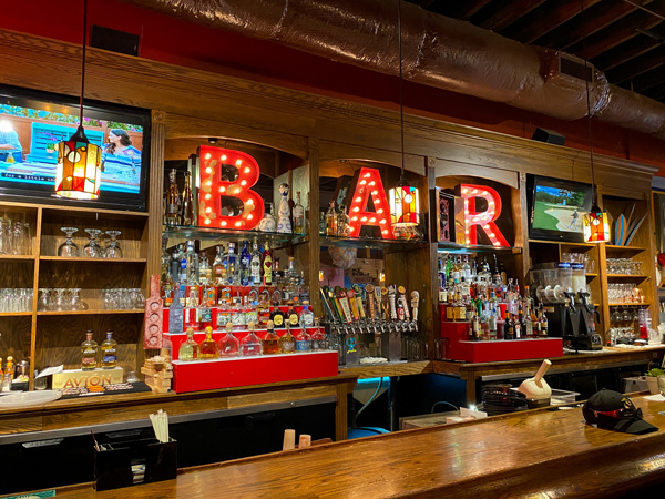 The Cantina Historic Biltmore Village Asheville NC with Tequila Bar with red bar light sign and bottles of liquor along brown bar