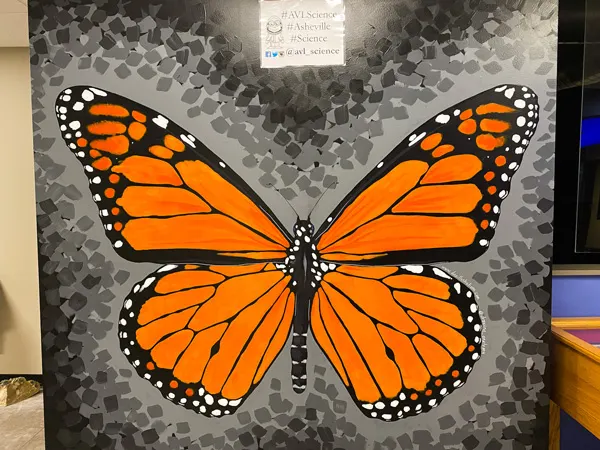Asheville Museum of Science with orange and black monarch butterfly mural