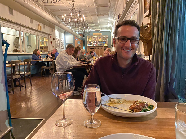 Tom with food at Limones' table