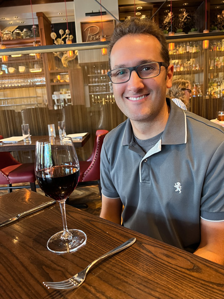 Tom with wine at Posana