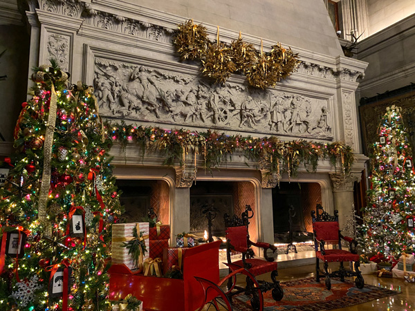 Biltmore Estate Candlelight Christmas Evenings with three-hole fireplace surrounded by two Christmas trees