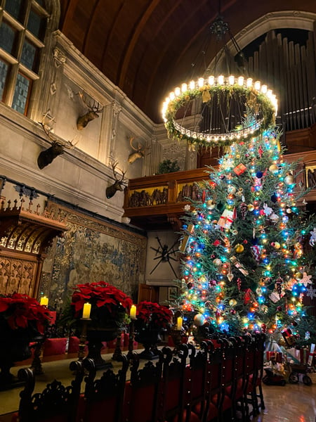 Biltmore Estate Christmas Tree in Banquet Hall with long table set with candles