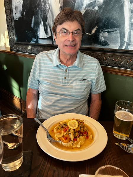 Christine's dad with food at Cedric's Tavern