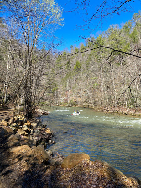 Laurel River Trail with raft-like double kayak on whitewater rapids near Hot Springs NC