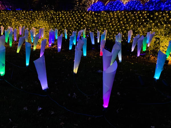 Colorful rainbow lights wrapped up in white paper cones at Winter Lights In Asheville, NC 