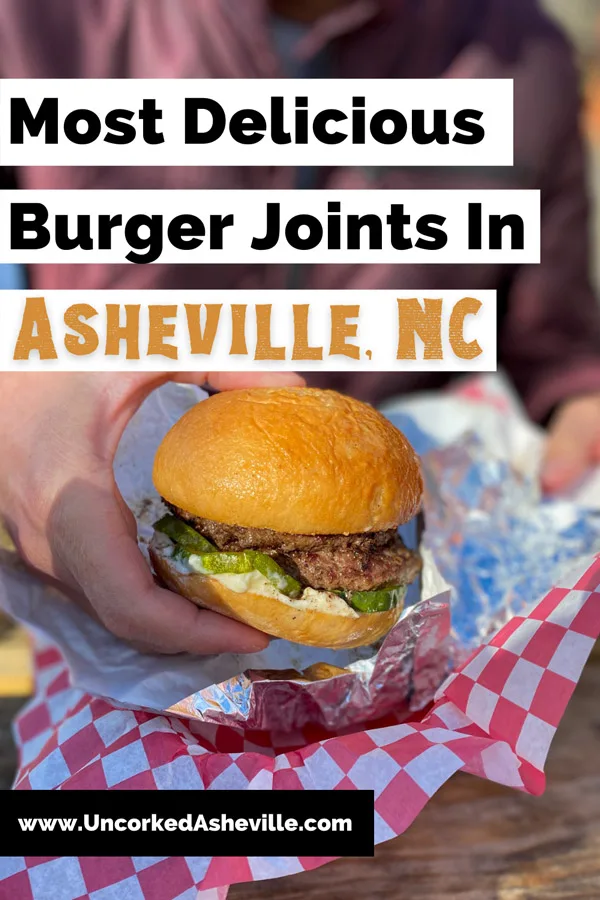 Burger Places In Asheville North Carolina Pinterest pin with blurred man in purple coat holding a beef burger on a gluten free bun at Baby Bull in the River Arts District of Asheville NC