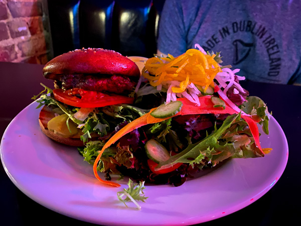 The Malvern burgers in Asheville NC with gluten-free burger with lettuce, tomato, and bun with side salad