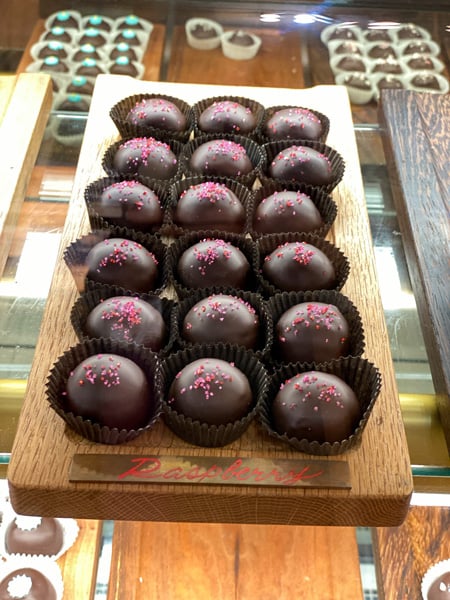 Asheville Chocolate Truffles with 18 dark chocolate truffles with pink sugar on top