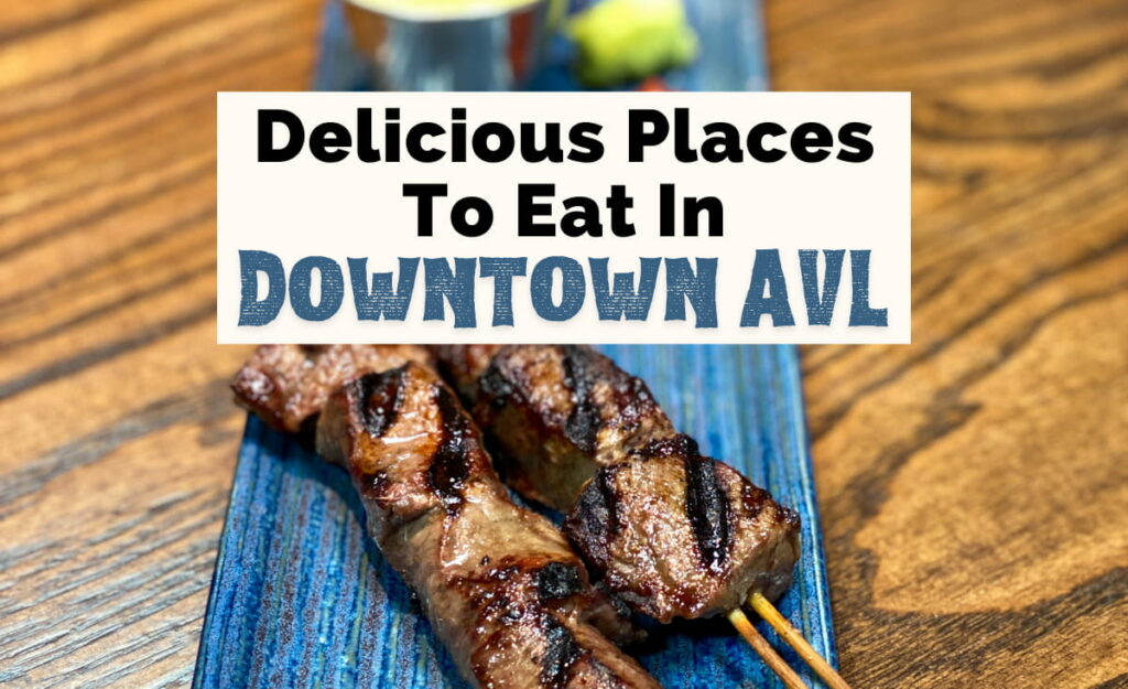 Downtown Asheville Restaurants And Places To Eat with beef skewers on blue plate with sauces from Ukiah Japanese Smokehouse