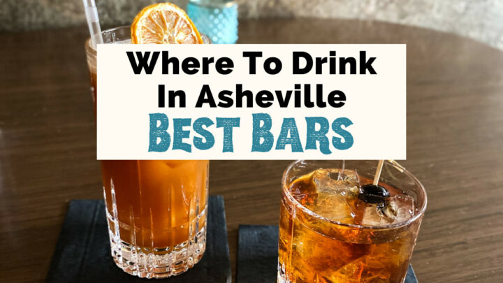 Best bars in Asheville NC with two brown cocktails on table, one in high ball glass with straw and lemon garnish and the other in a low ball with ice cubes and black cherry