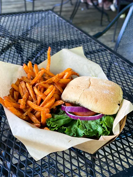 Old Rock Cafe Chimney Rock Village NC with grilled chicken sandwich on bun with lettuce, tomato, and onions, and sweet potato fries