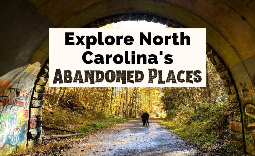 Abandoned Places in North Carolina with image of Road to Nowhere tunnel in Bryson City NC with two people walking out of dark tunnel with urban art and yellow fall foliage