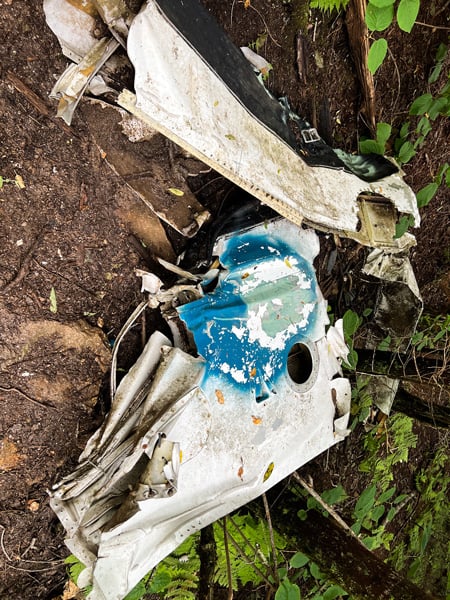 Crashed Passengers Aircraft Waterrock Knob North Carolina with image of part of Cessna plane debris on ground in dirt