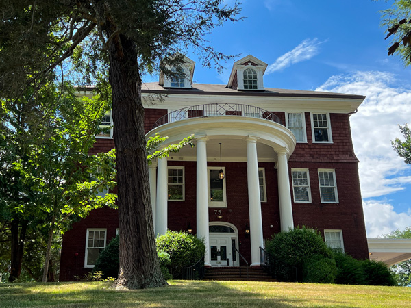 Former Highland Hospital Montford Asheville NC with historic three-floor red building with 4 white columns