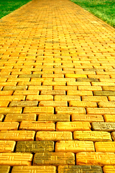 Land of Oz Theme Park, Beech Mountain NC with yellow brick road next to green grass