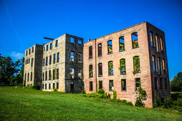 St Agnes Hospital in Raleigh NC by Keenan Hairston photo with old brick wall structure with windows with no roof and vines growing out of windows