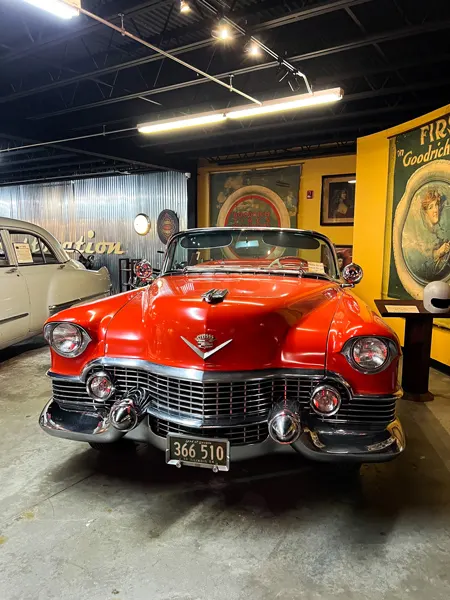 Wheels Through Time Motorcycle Museum Maggie Valley NC with front of antique red Cadillac