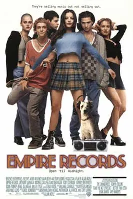 Empire Records Movie Poster with six people standing in different poses with woman in blue sweater and plaid skirt in front
