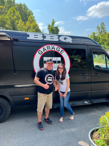 Christine and owner of Garage BBQ in front of food truck