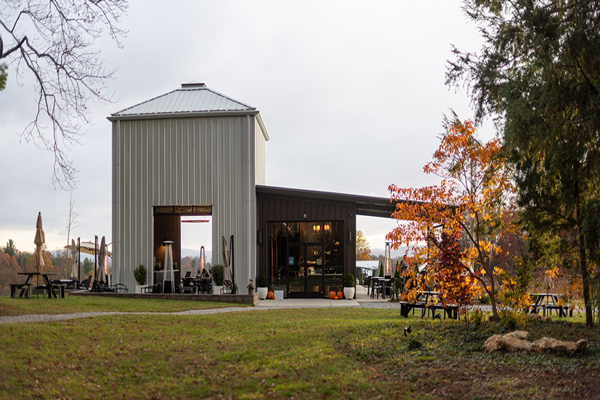 Marked Tree Vineyard Flat Rock North Carolina Tasting Room with white and brown modern building and fall foliage trees
