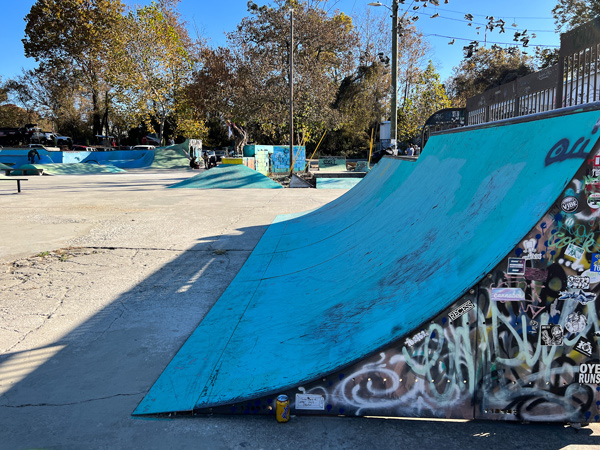 RAD Foundation SkatePark Asheville NC with blue skate ramp in concrete area filled with ramps and rails