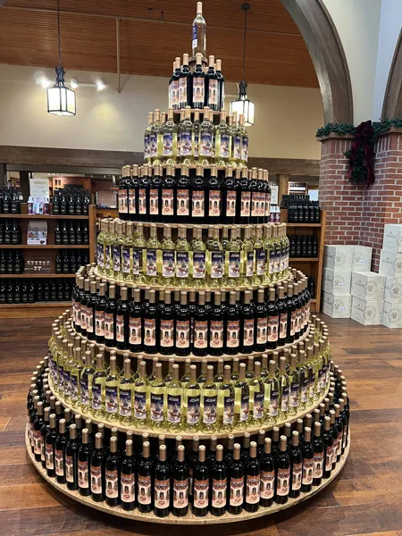 Biltmore Winerystore in Asheville, NC with bottles of red and white Biltmore wine stacked in shape of Christmas tree