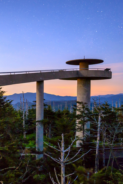 Clingmans Dome at Great Smoky Mountains National Park which is a curving walking bridge leading up to a viewing tower overlooking the mountains