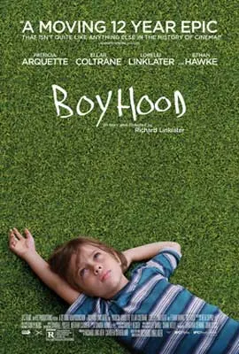 Boyhood Movie Poster with image of young white person in striped shirt lying on green grass