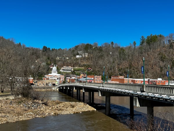 Historic Downtown Marshall North Carolina with view from Blannahassett Island with bridge over the French Broad River leading to the Madison County Courthouse and Main Street