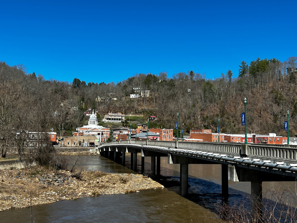 Historic Downtown Marshall North Carolina with view from Blannahassett Island with bridge over the French Broad River leading to the Madison County Courthouse and Main Street