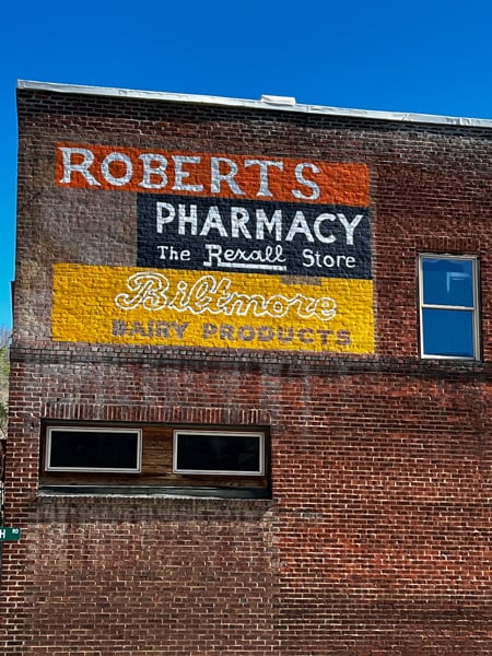 Old  Roberts Pharmacy and Biltmore Dairy Products Mural on red brick wall in Historic Downtown Marshall