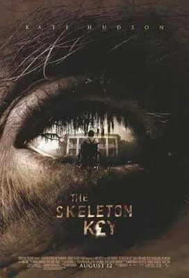 The Skeleton Key Movie Poster with image of close up of eye with house and person standing in front of it in eye