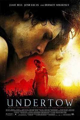 Undertow Movie Poster with image of two people intimately embraced back to stomach and person below in field