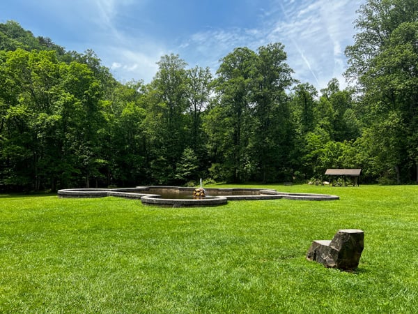 Andrews Geyser in Old Fort NC small fountain and park with tables, benches, and green grass surrounded by trees