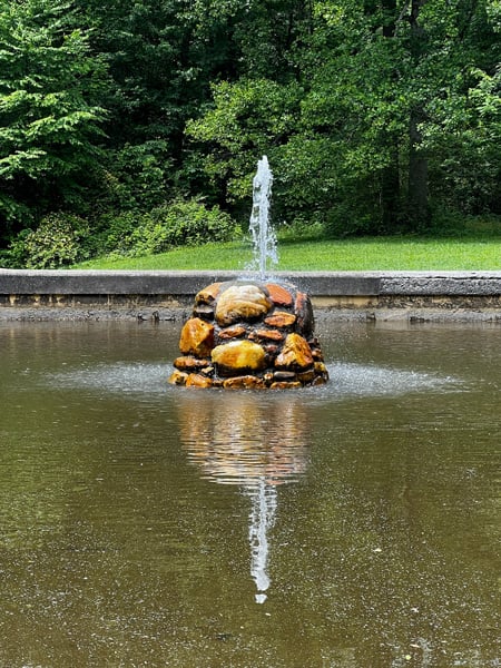 Andrews Geyser in Old Fort North Carolina with small stone fountain with water shooting a few feet straight into the air