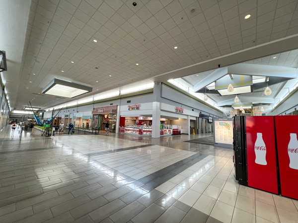 Asheville Mall with white tiled floors and shops