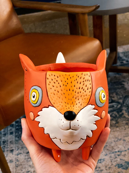 LOFT Asheville NC white hand holding up a fox ceramic planter