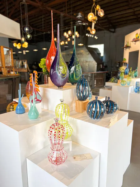 Lexington Glassworks in Asheville NC shop display with blown glass vases of varying shapes and colors