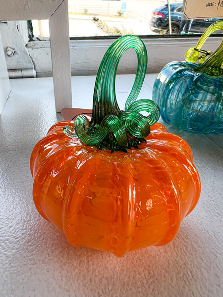 Lexington Glassworks in Asheville North Carolina orange pumpkin with green stem made from blown glass