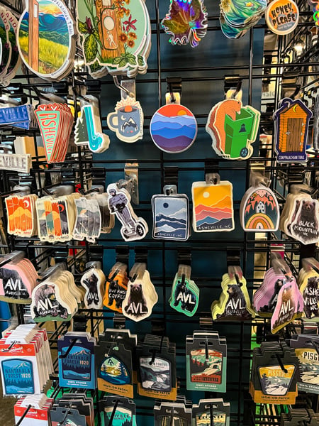 Second Gear in Asheville NC Consignment Store with themed stickers about the mountains, hiking, Asheville, bears, and more