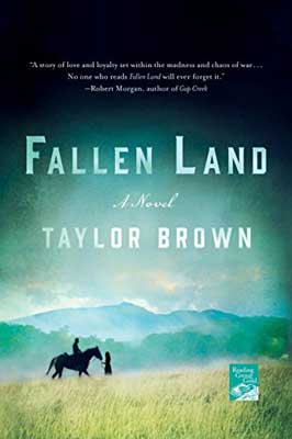 Fallen Land by Taylor Brown book cover with horse and people in distance on green grass landscape with blue mountains in the background