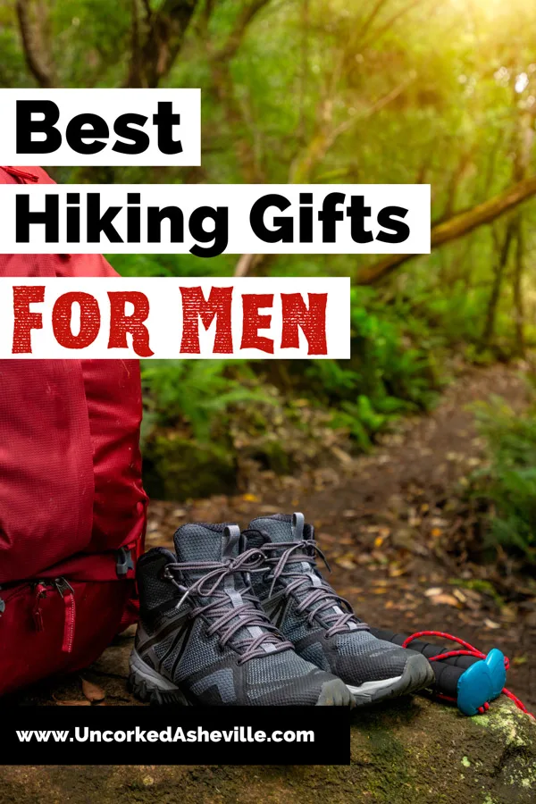 Best Hiking Gifts For Men Pinterest pin with URL of website and image of with red hiking backpack, water bottle, hiking shoes, and hiking poles in green forest with brown dirt