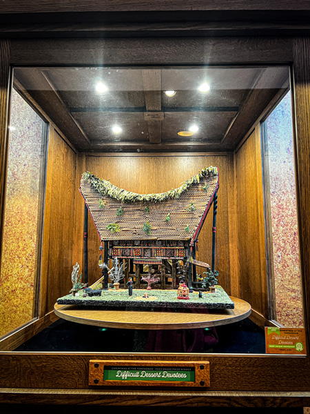 National Gingerbread House Competition 2023 Winner with Indonesian gingerbread home turning in a glass display glass