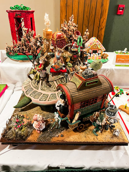 Gingerbread display with wagon and people at the National Gingerbread House Competition at the Omni Grove Park Inn in Asheville, NC