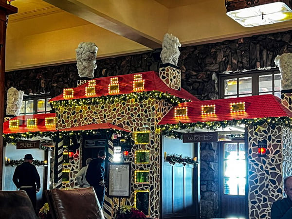 The Great Gingerbread House at the Omni Grove Park Inn in Asheville, NC; it is a life size replica of the resort made completely from food and seconds as a hot chocolate stand