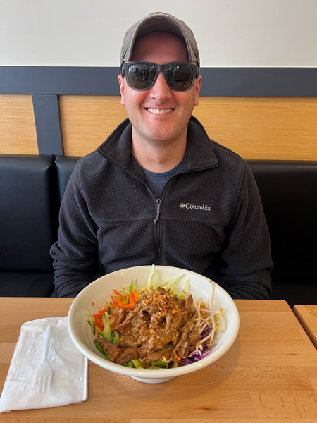 Tom eating Pho Real's cold noodle bowl