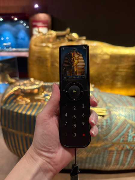 Tutankhamun Exhibit Audioguide with coffins