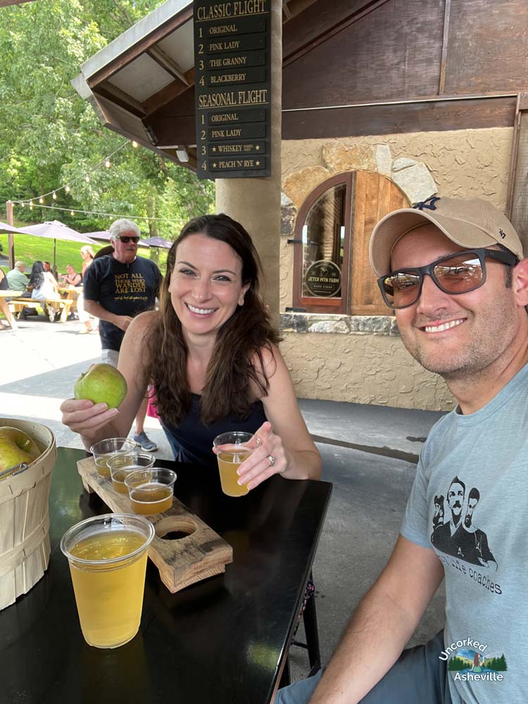 Us with Jeter Mountain Farm cider and u-pick apples Hendersonville NC